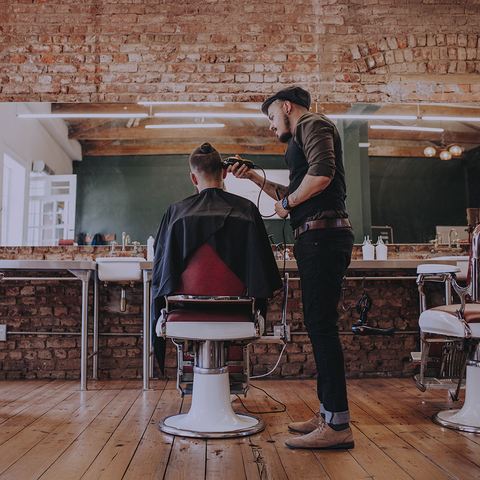 barber cutting someone's hair